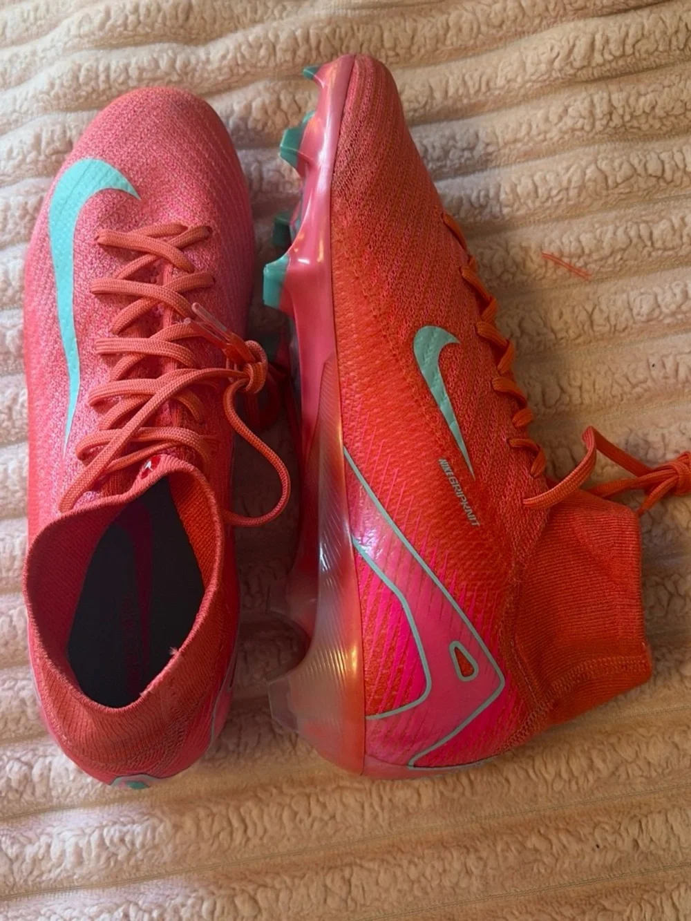 Nike Women's Pink Soccer Cleats with Teal Swoosh